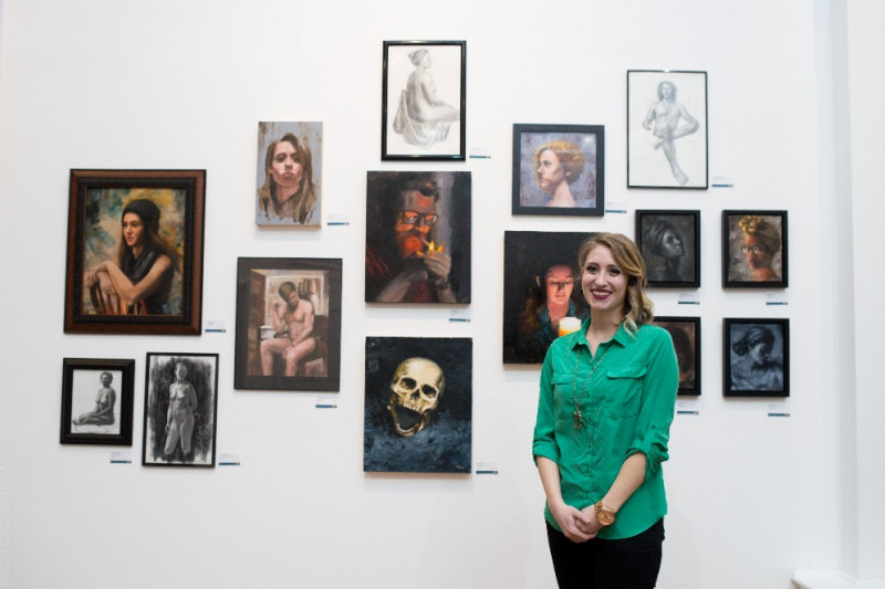 woman with art exhibit