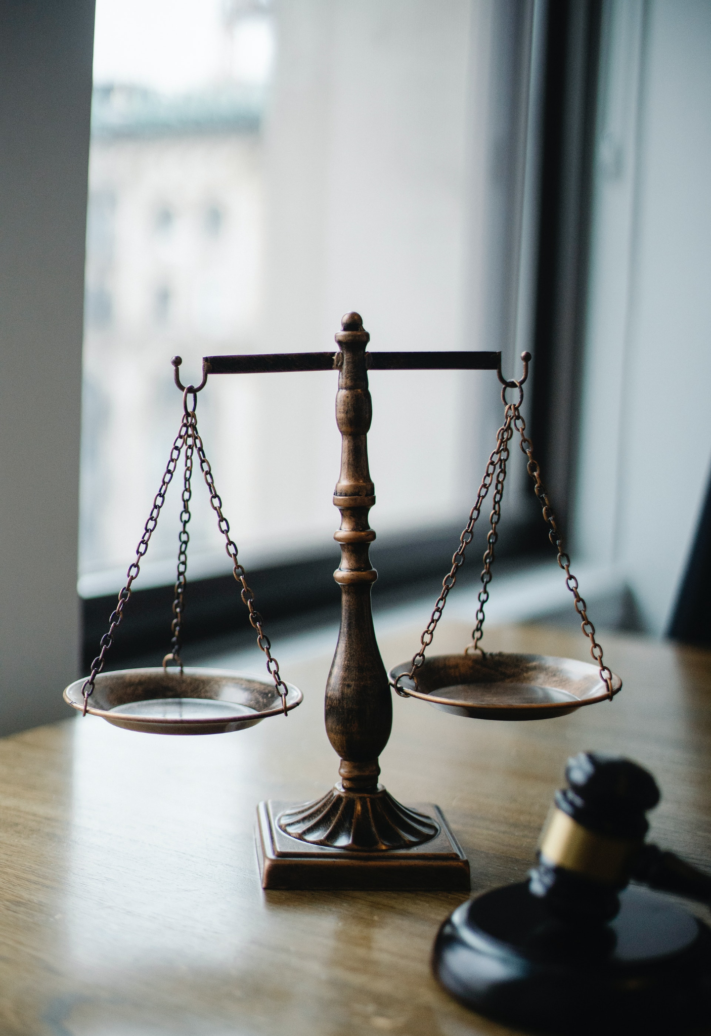 A scale and gavel representing the law.