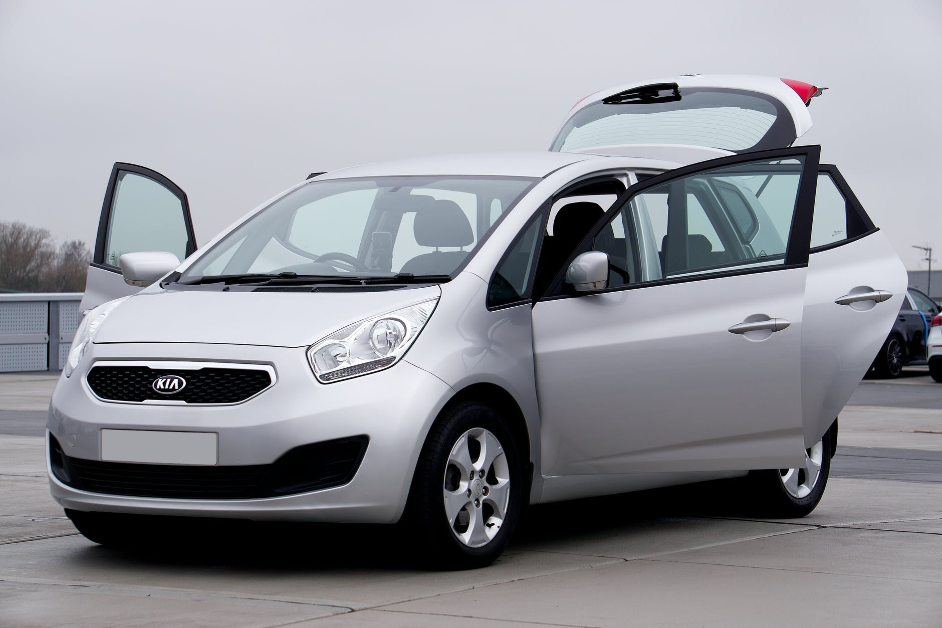 A KIA vehicle with all doors open at one of the demo cars for sale Brisbane dealerships yard