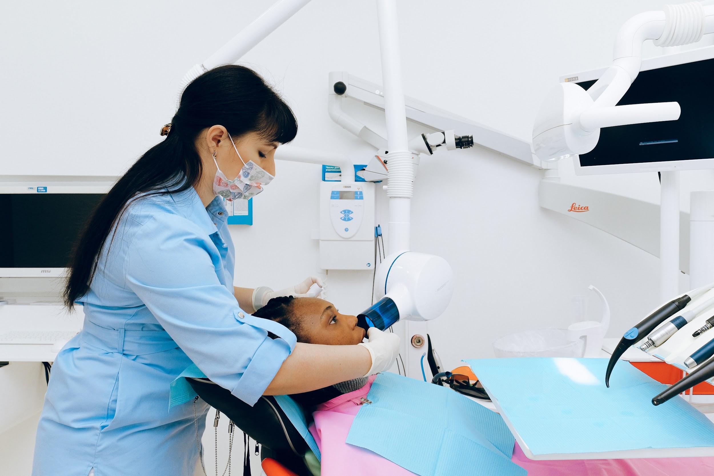 dental professional with patient getting ready for wisdom tooth removal