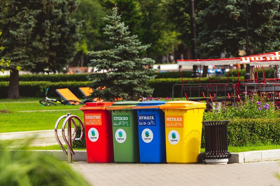 Colored bins lining up on the road with 240 litre compostable wheelie bin liners