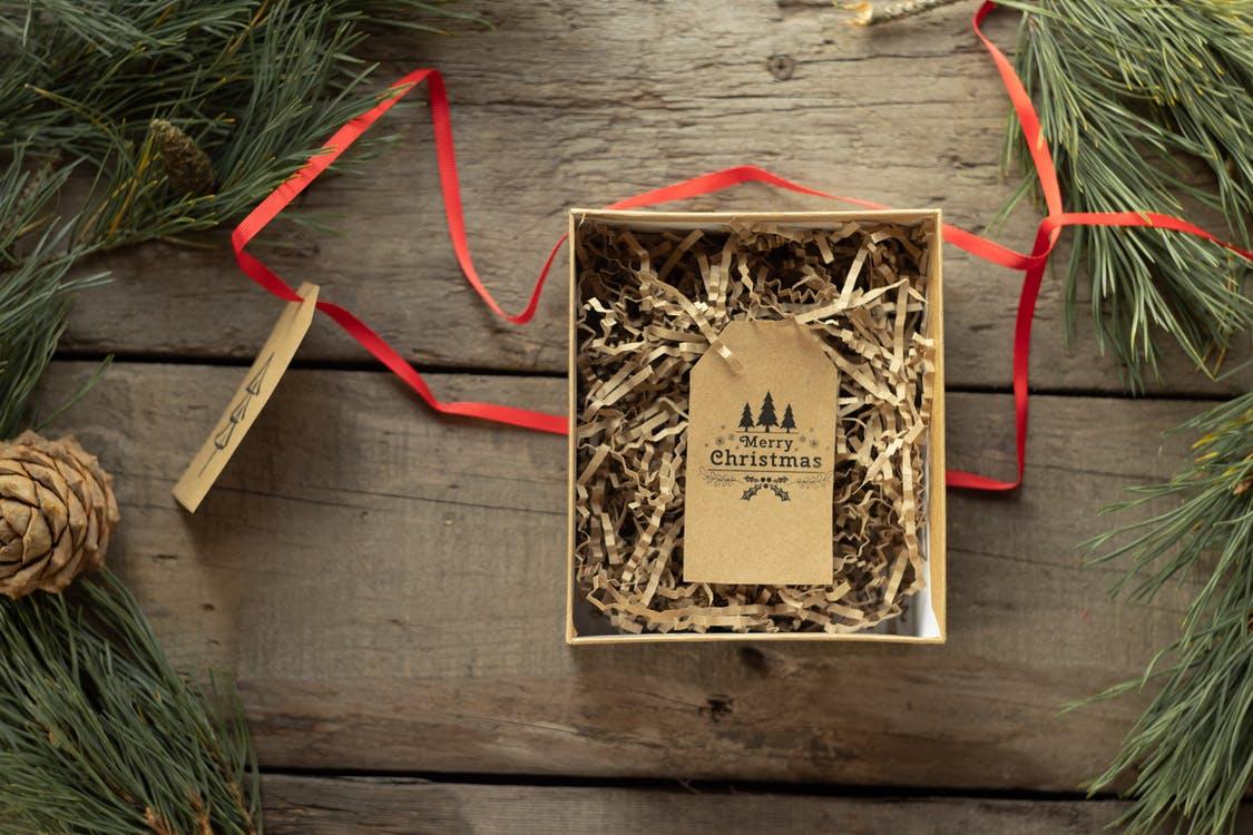 Handmade tag with Merry Christmas inscription in carton box